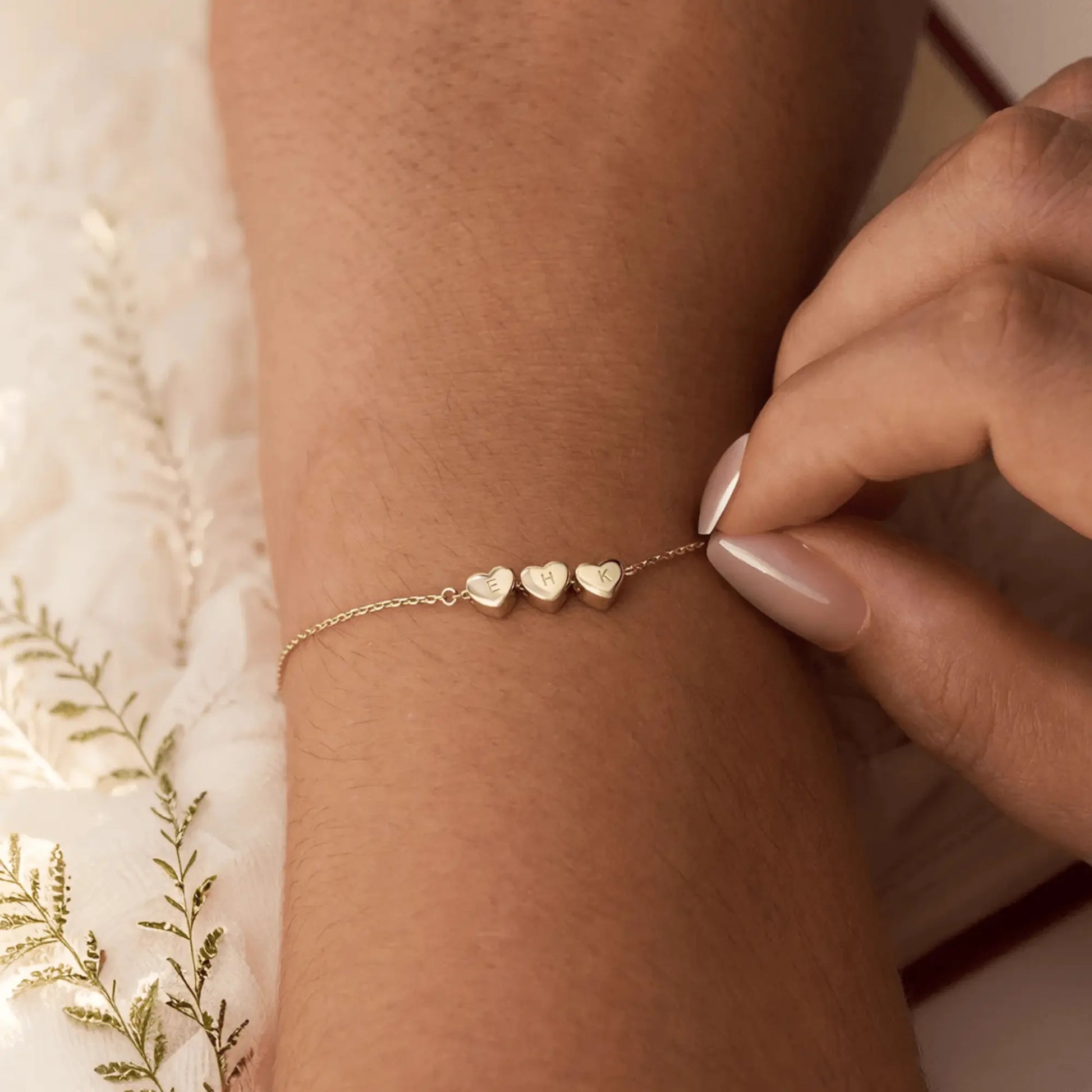 Custom heart initial bracelet with multiple hearts — family or best friend keepsake